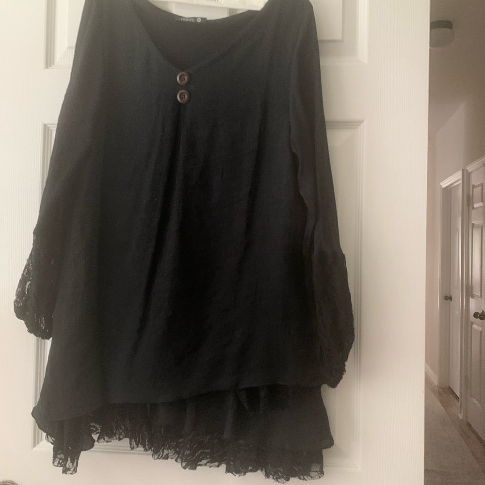 Oversized top. Two buttons Lace on sleeves and hem.